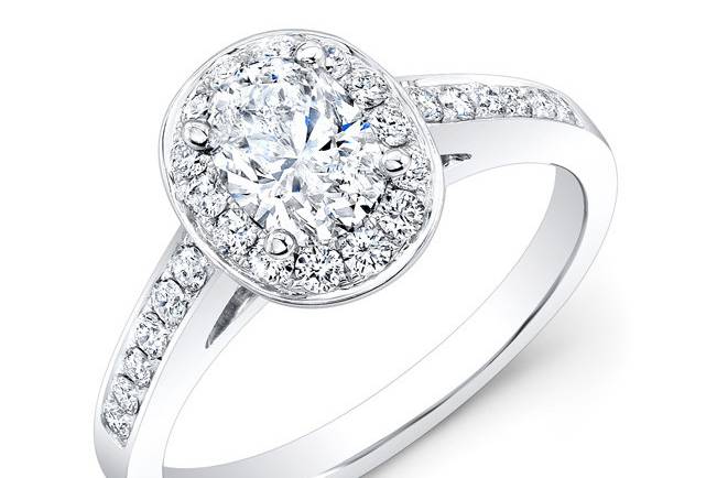 ENG-5597
This 18KT white gold engagement ring features a halo design with 0.48PTS of 28 round diamonds. The center stone is an oval-shaped diamond that weighs 0.59PTS.
Call 213.626.6012 or chat with us at www.goldempirejewelry.com to get the best deal for this beautiful piece!