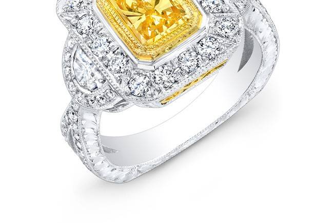 LAD-8166
This 18KT two-tone (white & yellow gold) fashion ring features 0.38PTS of baguettes on the side and 1.45CTS of pave set round diamonds. The center stone is a 2.03CT radiant-cut yellow diamond.
Call 213.626.6012 or chat with us at www.goldempirejewelry.com to get the best deal for this beautiful piece!