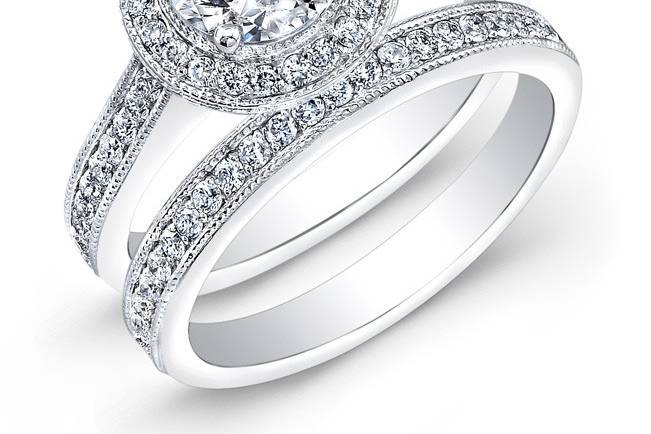 BRD-2006
This vintage-style 14KT white gold wedding set features a halo design and a milgrain finish along the edges of 86 pave-set round diamonds that weigh 0.70PTS in total. It may also feature the center stone of your choice!
Call 213.626.6012 or chat with us at www.goldempirejewelry.com to get the best deal for this beautiful piece!
