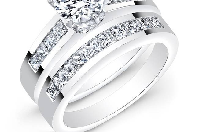 BRD-2008
This 14KT white gold wedding set features 1.10CTS of 18 channel-set princess-cut diamonds. It may also feature the center stone of your choice!
Call 213.626.6012 or chat with us at www.goldempirejewelry.com to get the best deal for this beautiful set!