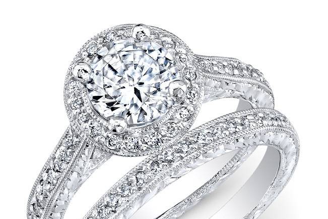 ENG-5113
This vintage-style platinum wedding set features a halo design, as well as a special hand engraving and milgrain finish along the edges of 50 pave-set round diamonds that weigh 0.45PTS. It may also feature the center stone of your choice!
Call 213.626.6012 or chat with us at www.goldempirejewelry.com to get the best deal for this beautiful piece!