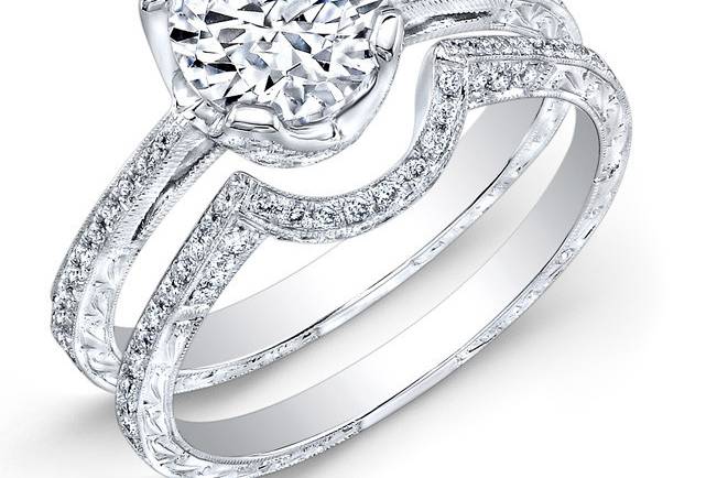 ENG-5331
This vintage-style 18KT white gold wedding set features a special hand engraving and a milgrain finish along the edges of 127 round diamonds that weigh 0.54PTS. It may also feature the center stone of your choice!
Call 213.626.6012 or chat with us at www.goldempirejewelry.com to get the best deal for this beautiful set!