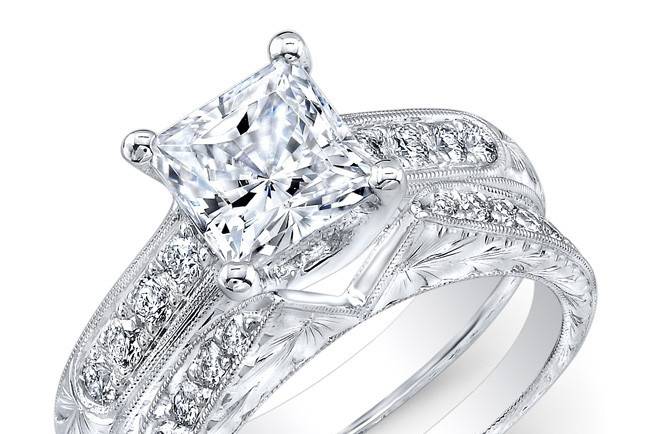 ENG-5526
This vintage-style platinum wedding set features a special hand engraving and a milgrain finish along the edges of 18 pave-set round diamonds that weigh 0.51PTS. It may also feature the center stone of your choice!
Call 213.626.6012 or chat with us at www.goldempirejewelry.com to get the best deal for this beautiful set!