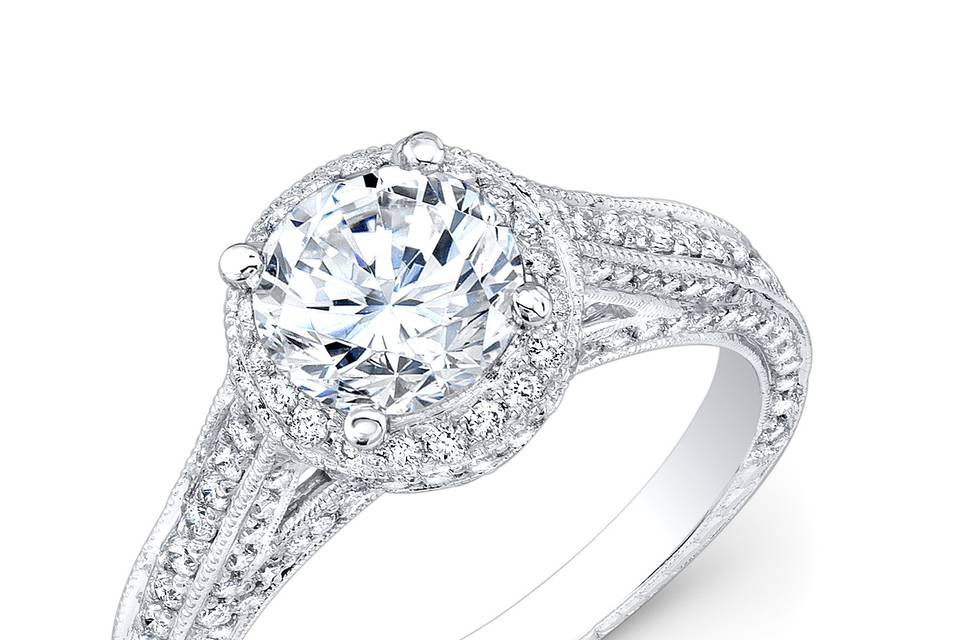 ENG-5329
This vintage-style 18KT white gold engagement ring features a halo design and a milgrain finish along the edges of 168 pave-set round diamonds that weigh 0.86PTS in total. It may also feature the center stone of your choice!
Call 213.626.6012 or chat with us at www.goldempirejewelry.com to get the best deal for this beautiful piece!