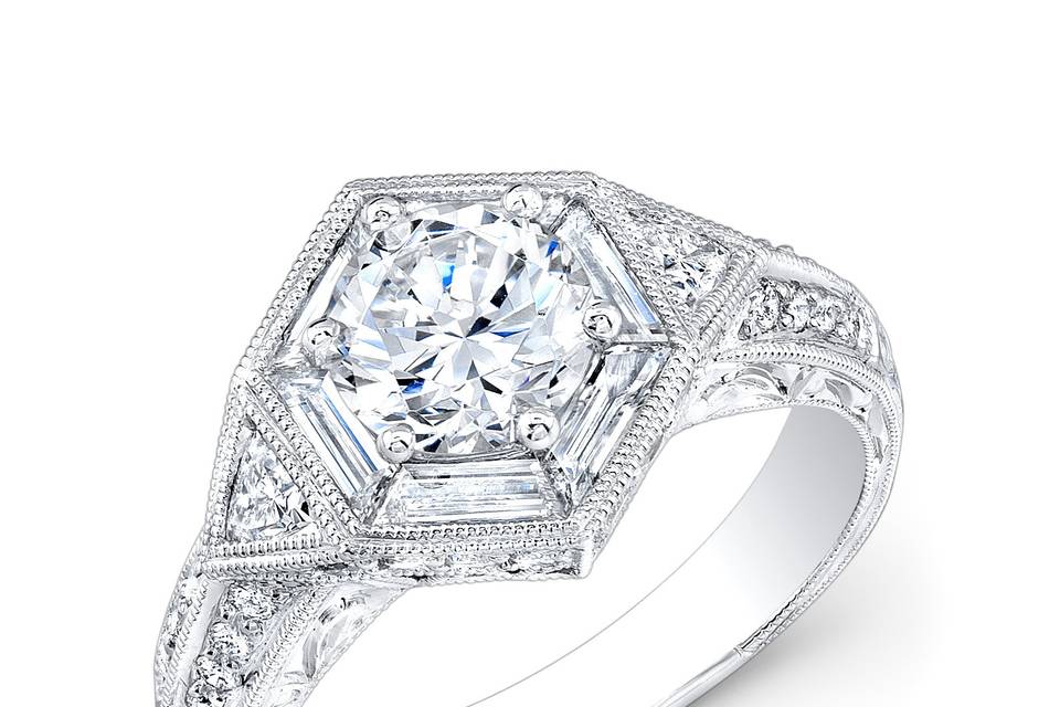 ENG-5603
This vintage-style 18KT white gold engagement ring features 0.37PTS of 32 pave-set round diamonds, 0.23PTS of 2 trillion-cut diamonds and 0.52PTS of 6 baguette diamonds surrounding the center. It may also feature the center stone of your choice!
Call 213.626.6012 or chat with us at www.goldempirejewelry.com to get the best deal for this beautiful piece!