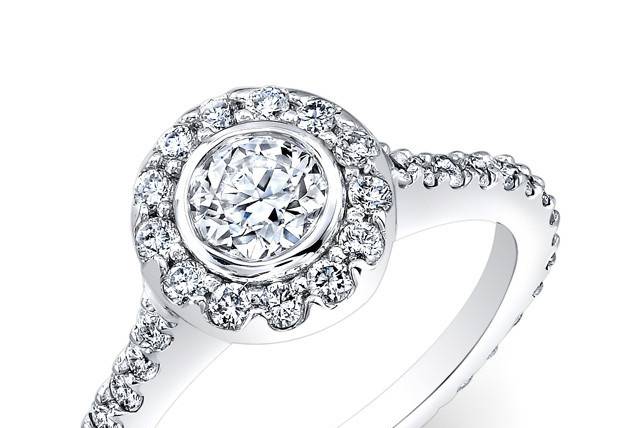 ENG-5518A
This 14KT white gold engagement ring features a halo design with 69 prong-set round diamonds. The center stone is a bezel-set round brilliant diamond that weighs 1.36CTS.
Call 213.626.6012 or chat with us at www.goldempirejewelry.com to get the best deal for this beautiful piece!