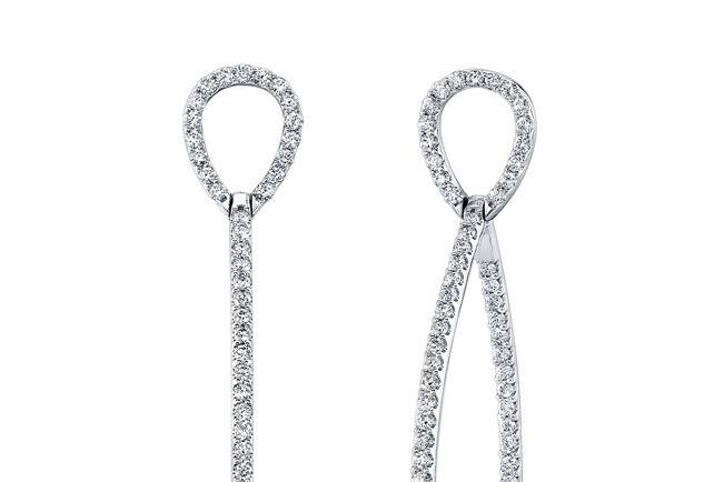 EAR-4017 (http://www.goldempirejewelry.com/fashion/earrings/ear-4017.html)
This 14kt white gold pair of dangling earrings features 1.67cts of 138 full-cut round brilliant diamonds that are pre-set.
Call for price 213.626.6012