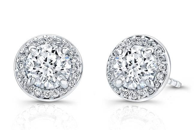 ESTD-4010
(http://www.goldempirejewelry.com/fashion/earrings/studs/estd-4010.html)
This 14kt white gold pair of stud earrings features 1.24cts of two round brilliant center diamonds and a halo design set with 0.30pts of 40 full-cut round brilliant diamonds