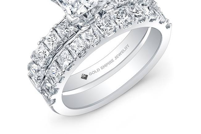 BRD-2017 (http://www.goldempirejewelry.com/bridal/brd-2021.html)
This 14kt white gold wedding set features 2.04CTS of 22 pre-set princess-cut diamonds. It may also feature the center stone of your choice!