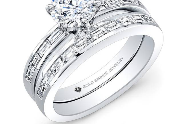 BRD-2018 (http://www.goldempirejewelry.com/bridal/brd-2019.html)
This modern-style 14kt white gold wedding set features 0.83 points of 18 channel-set baguette diamonds. It may also feature the center stone of your choice!
