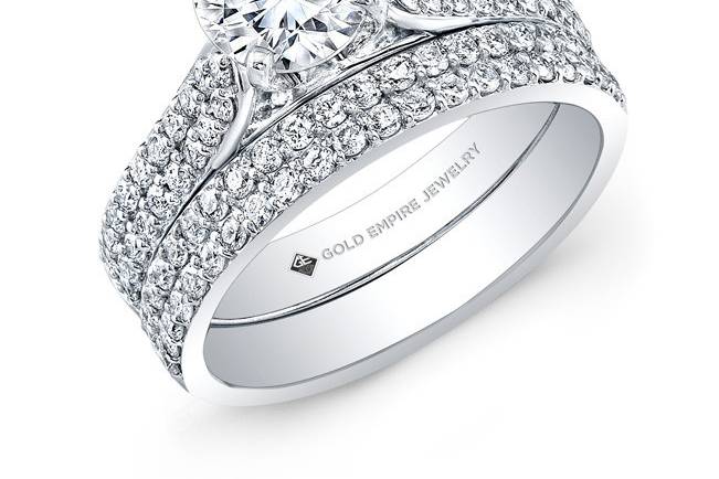BRD-2019 (http://www.goldempirejewelry.com/bridal/brd-2022.html)
This cathedral-style 14kt white gold wedding set features two rows of diamonds on each band with a total of 80 round diamonds weighing 0.80pts in total. It may also feature the center stone of your choice!