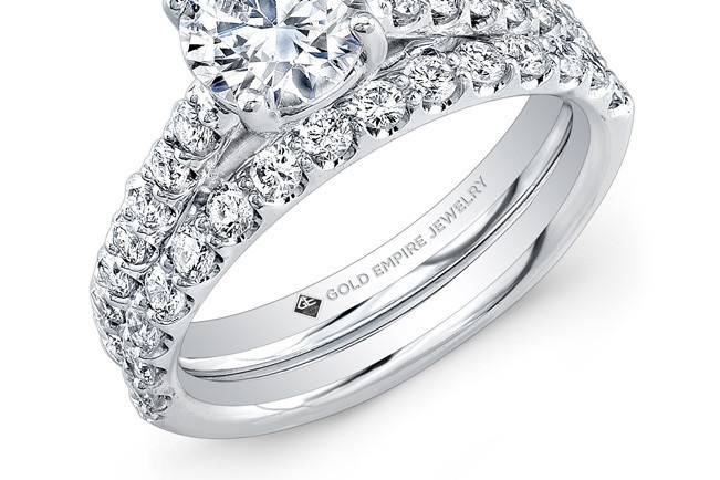 BRD-2020 (http://www.goldempirejewelry.com/bridal/brd-2020.html)
This 14kt white gold wedding set features 0.86pts of 29 round diamonds. It may also feature the center stone of your choice!
