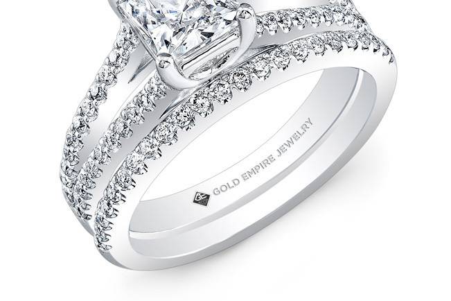 BRD-2025 (http://www.goldempirejewelry.com/bridal/wedding-sets/brd-2025.html)
This 14kt white gold wedding set features a split-shank design with 0.45 points of 67 full-cut round brilliant diamonds that are pre-set. It may also feature the center stone of your choice!
