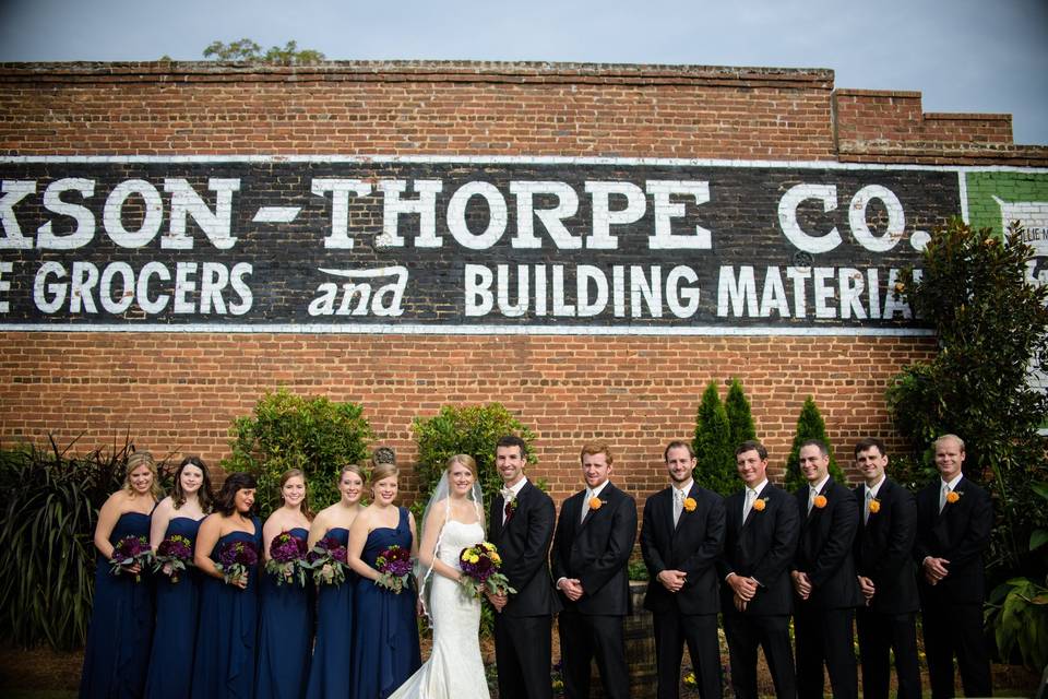 Newlyweds, bridesmaids, and groomsmen