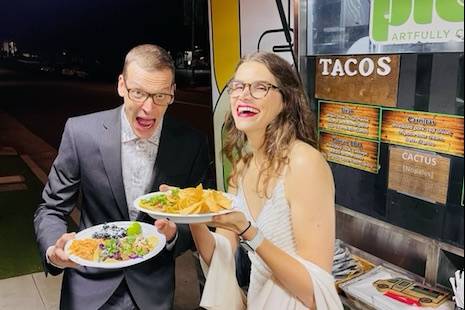 Happy couple with tacos