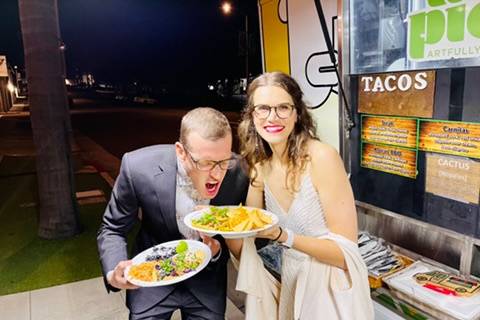 Happy couple with tacos