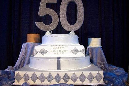 What an honor to be able to do Alan Jackson's special birthday cake.  Special embossed fondant, painted with edible silver, adorned this tall beauty.