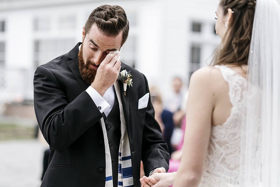 Groom crying at the altar