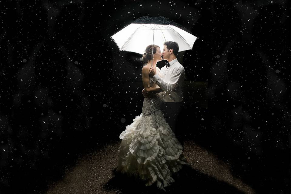 Bride and groom in the rain