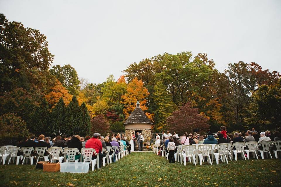 Fall Ceremony on The Green with Dovecote in background. Photo credit Ashley Dru Photography.