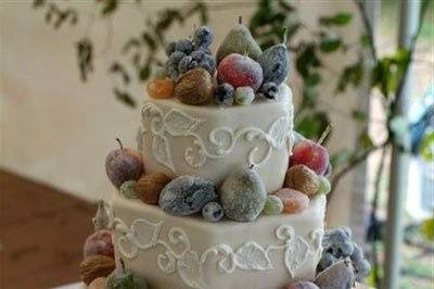 Crystalized edible fruits on a hexagonal shape cake