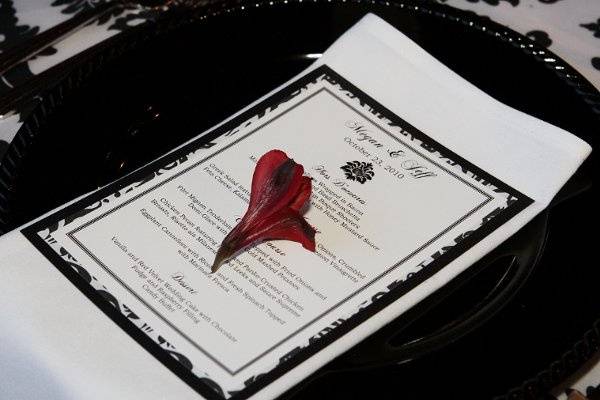 Menu card at each place setting with a single alstroemeria bud.