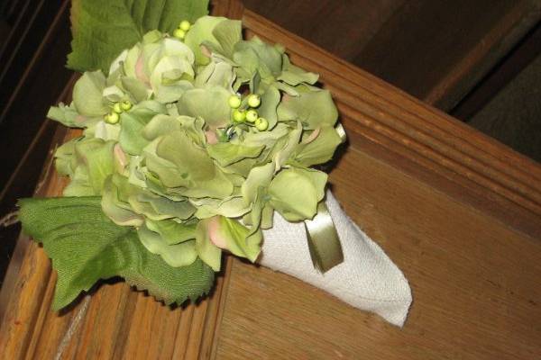 Handmade silk hydrangea and burlap pew cones.