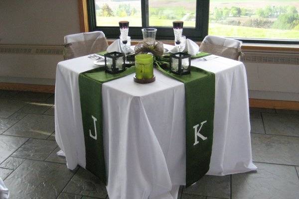 Escort card table featuring a tree round with handmade 