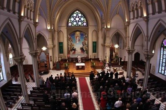 Ceremony location with deep red aisle runner.