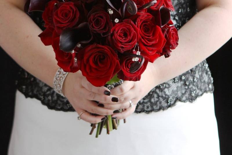 Bride's bouquet with roses, mini calla lilies and fiddlehead fern