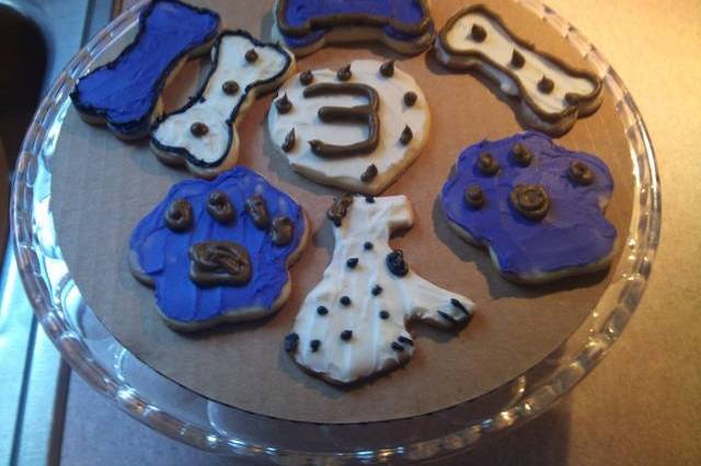 These are Cream Cheese cookies I made for a client's dogs birthday!! They are iced with Cream Cheese icing, then decorated.