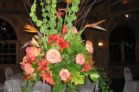 Flowers by Adam.  An array of orange roses, birds of paradise, bells of Ireland, Orchids and much more