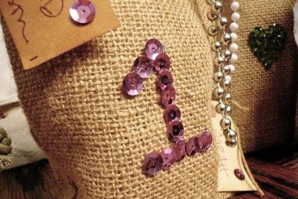 hese are fabulous and fun! yummy burlap sacks with your guests table numbers sparkling and gorgeous in vintage sequins. A perfect combination!
Use table numbers, initials...whatever you like! We make each bag by hand, so possibilities are endless. Sizes and colors can vary as well!
This listing is for ONLY 100 vintage sequin favor bags with table numbers and guest tags. There is nothing in the bags.
BUT...
we would love to work with you to fill them with loveliness!We encourage you to get in touch and have us put together a custom favor bag for you, your budget and your wedding!
