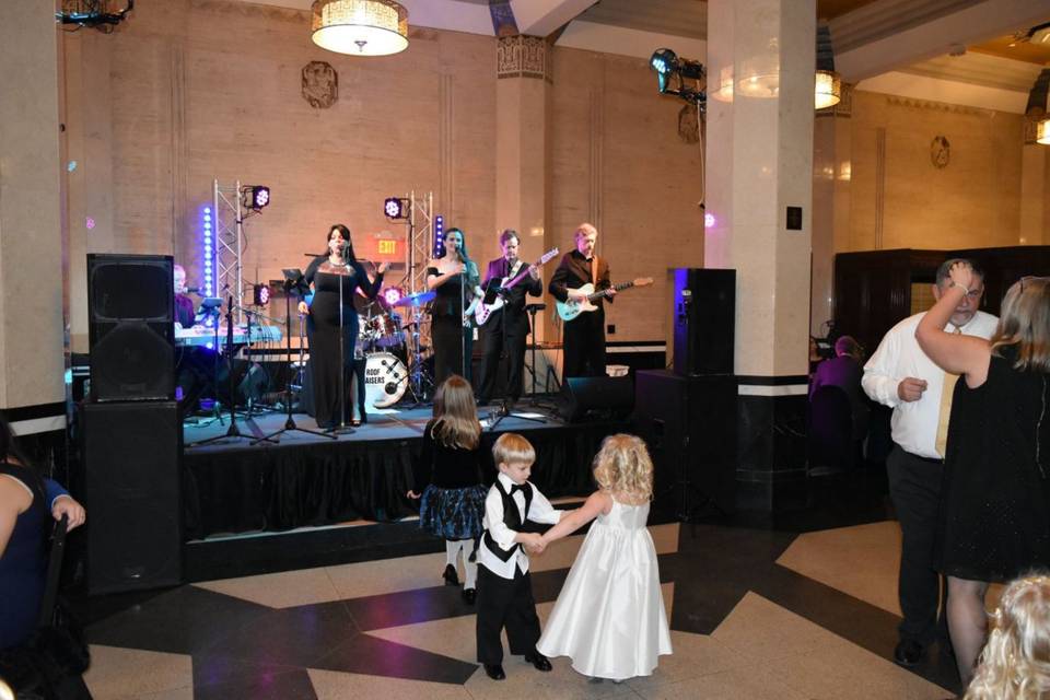 Ring bearer and flower girl dancing