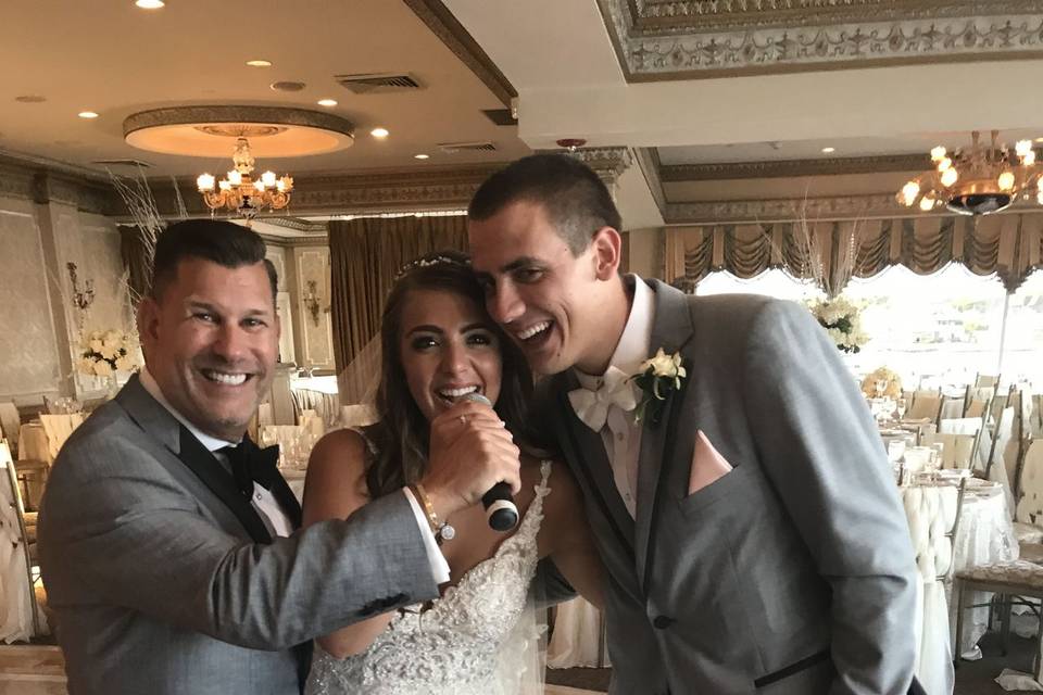 Newlyweds with their DJ