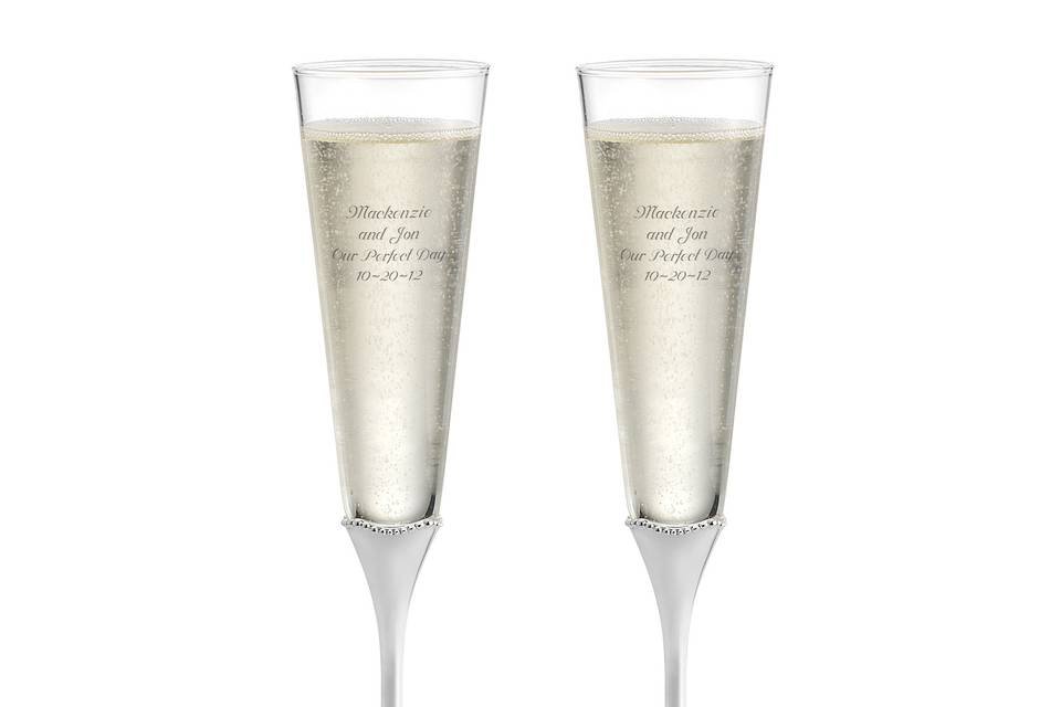<p>
Matching personalized toasting flutes will add a touch of glamour to your reception.</p>