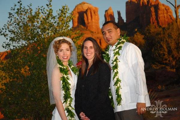 Bride and groom with the officiant