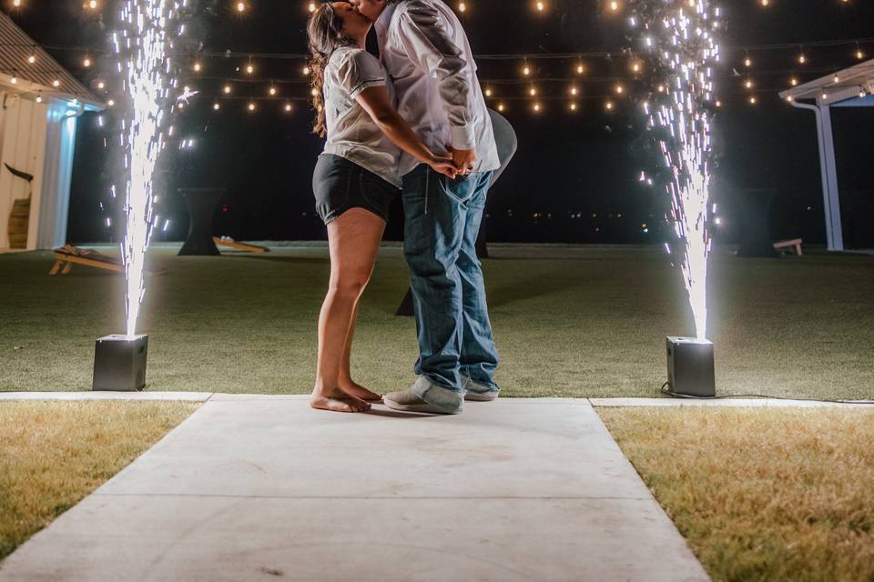 Couple exit with cold sparkler