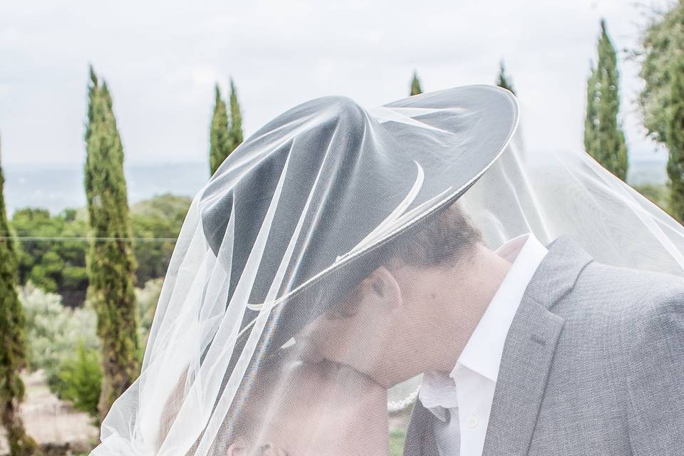 Bride + groom under the veil