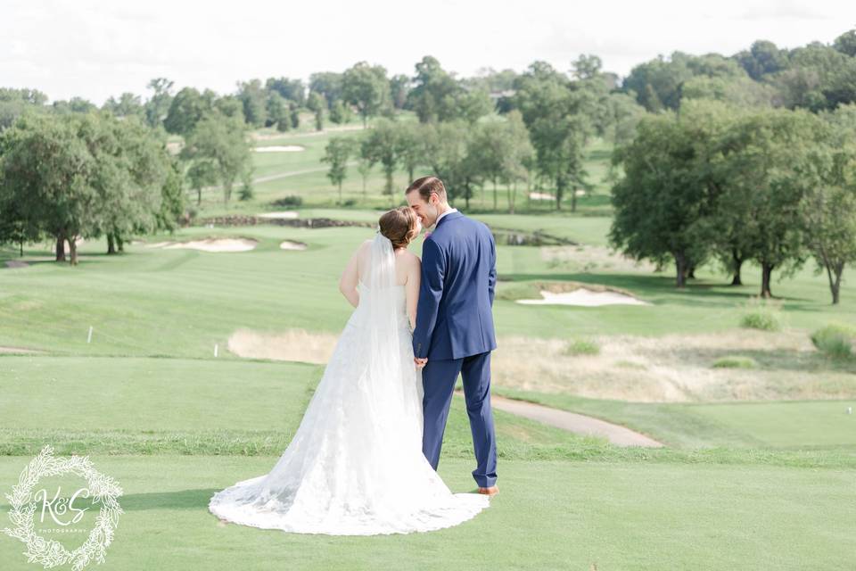 Bride and groom on golf course