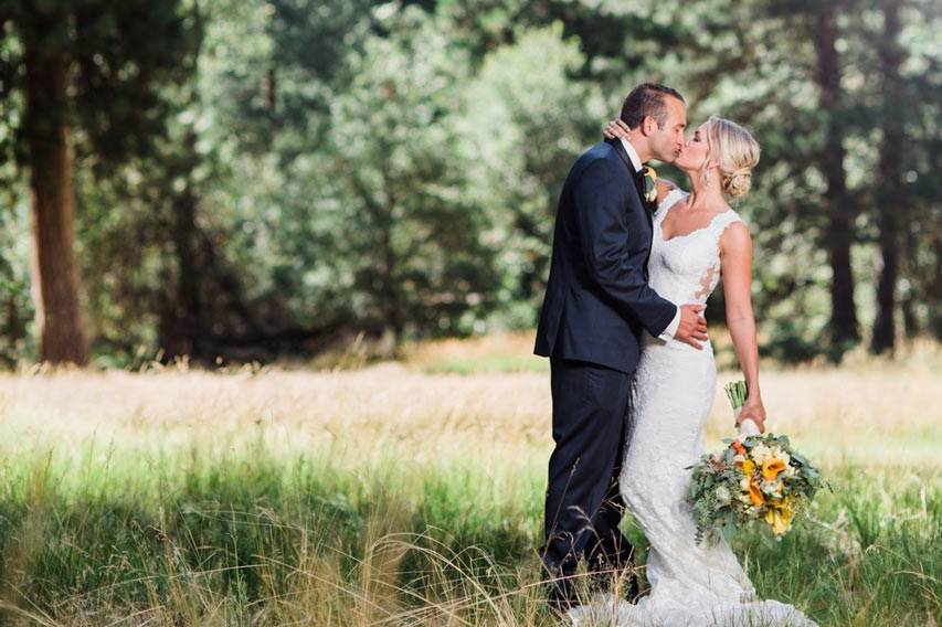 A special kiss in view of the forest and mountains