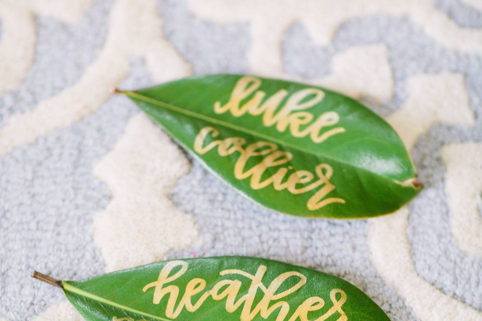 Place cards on magnolia leaves