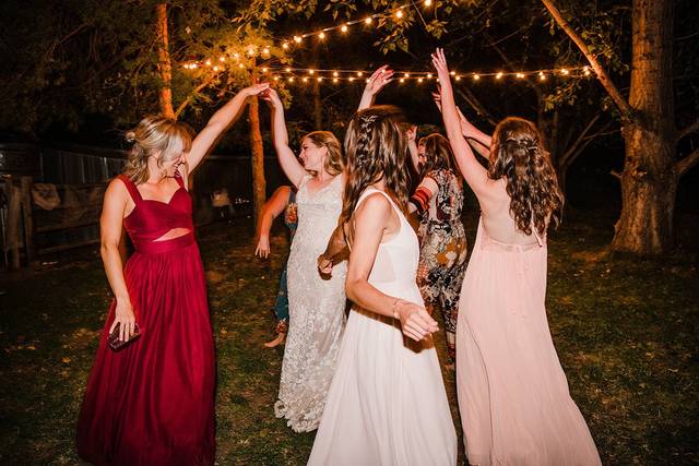 Bride and bridesmaids dancing
