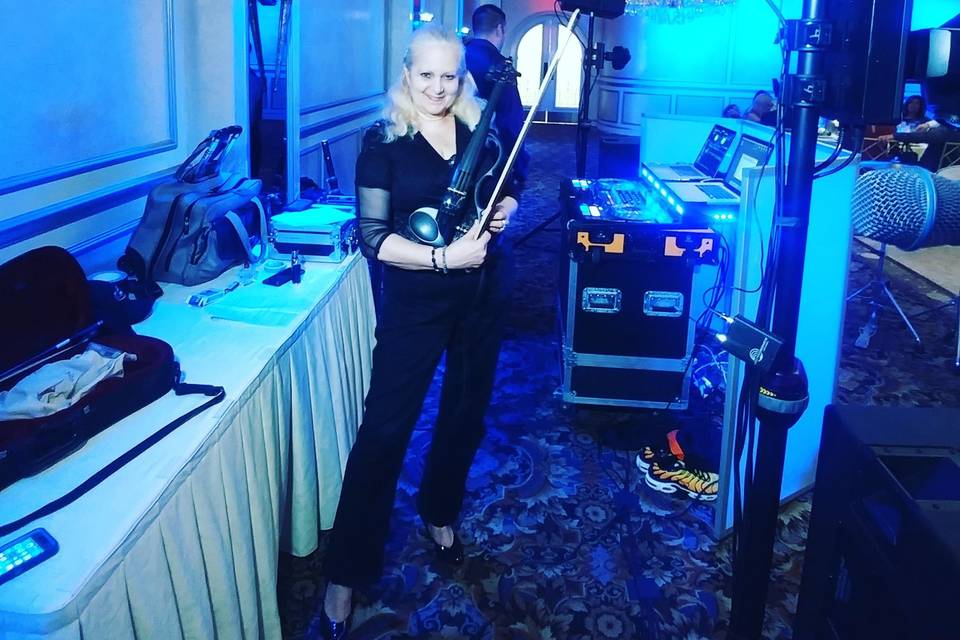 Electric violinist getting ready for an event