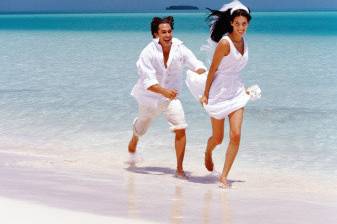 Couple running on the shore