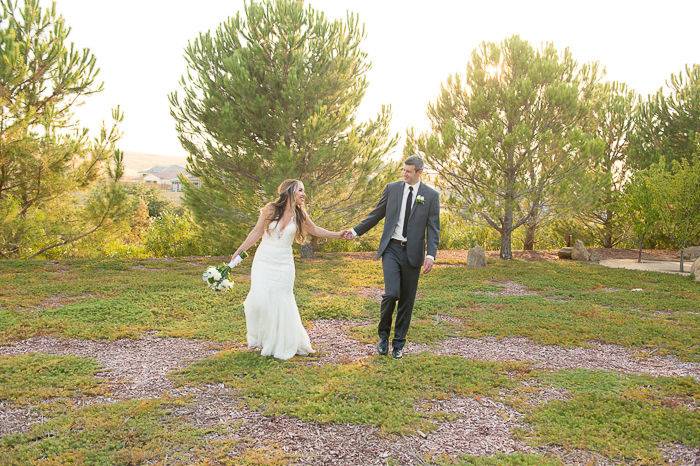 Bride and groom frolicing in the garden at Club Los Meganos Brentwood CA