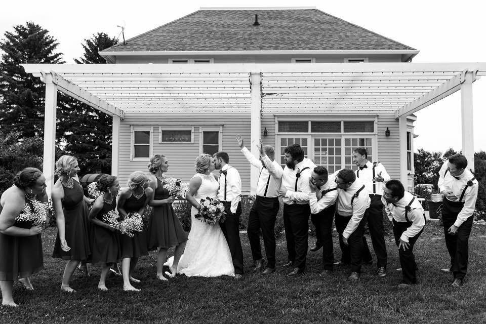 The couple with the bridesmaids and groomsmen