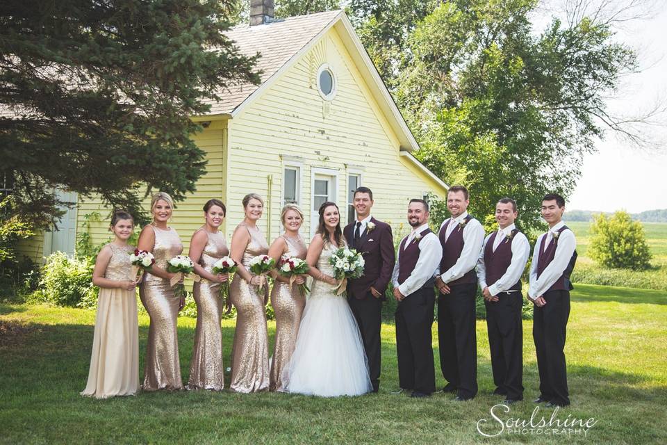 The couple with the bridesmaids and groomsmen