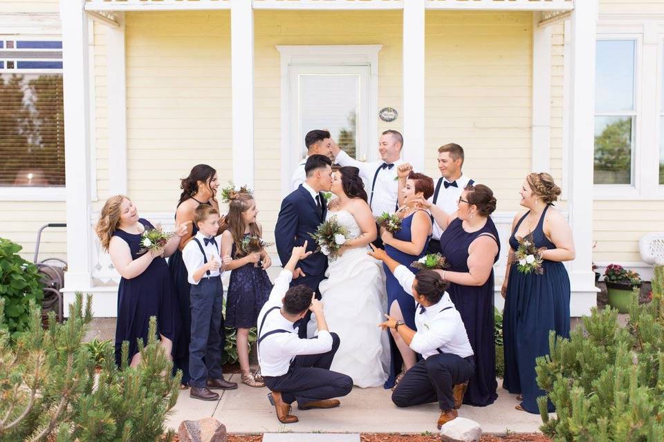 The couple with the bridesmaids and groomsmen