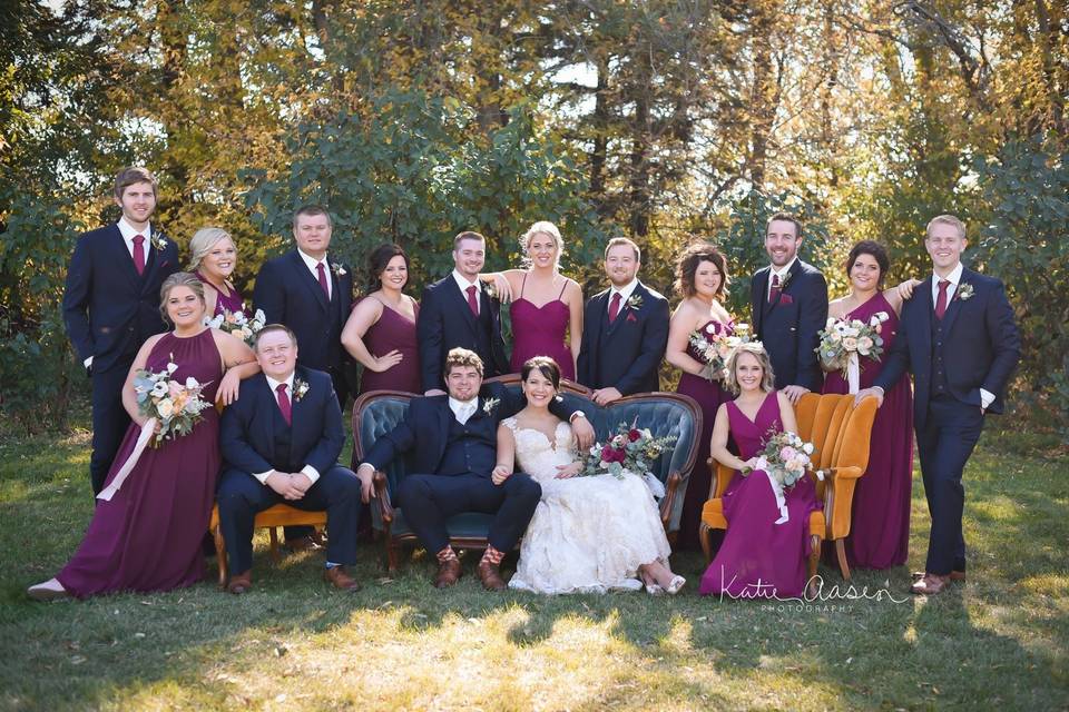 The couple with the bridesmaids and groomsmen